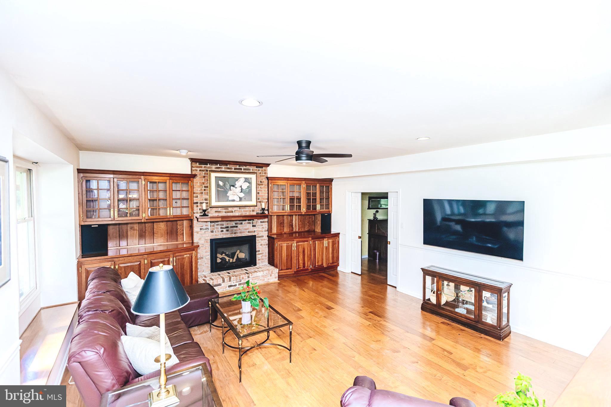 680 Fox Hollow Drive Yardley, PA 19067 - Photo 16 of 63 a living room with fireplace furniture and a flat screen tv