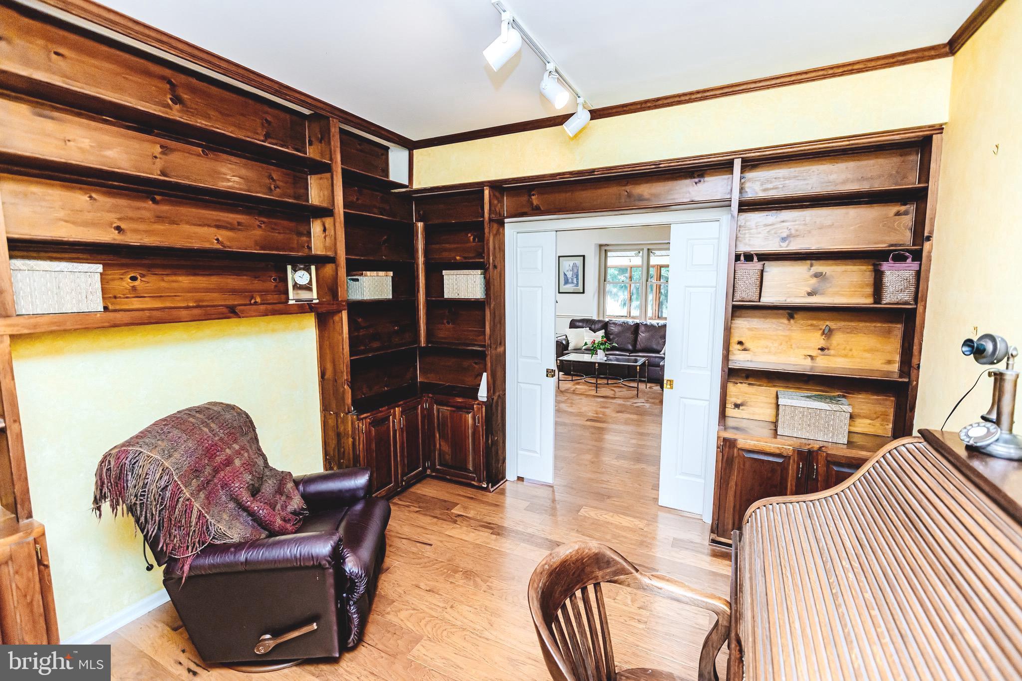 680 Fox Hollow Drive Yardley, PA 19067 - Photo 18 of 63 a living room with furniture a ceiling fan and a rug