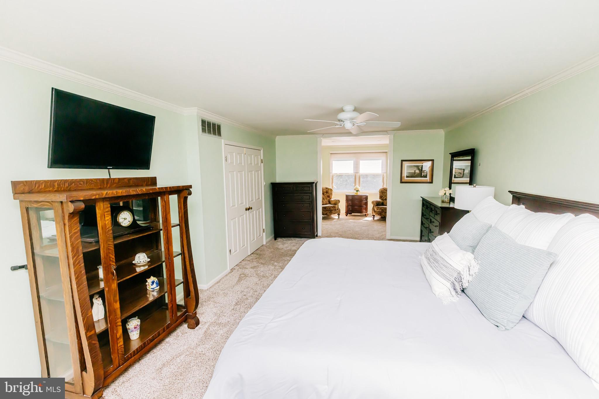 680 Fox Hollow Drive Yardley, PA 19067 - Photo 28 of 63 a spacious bedroom with a bed and a flat screen tv