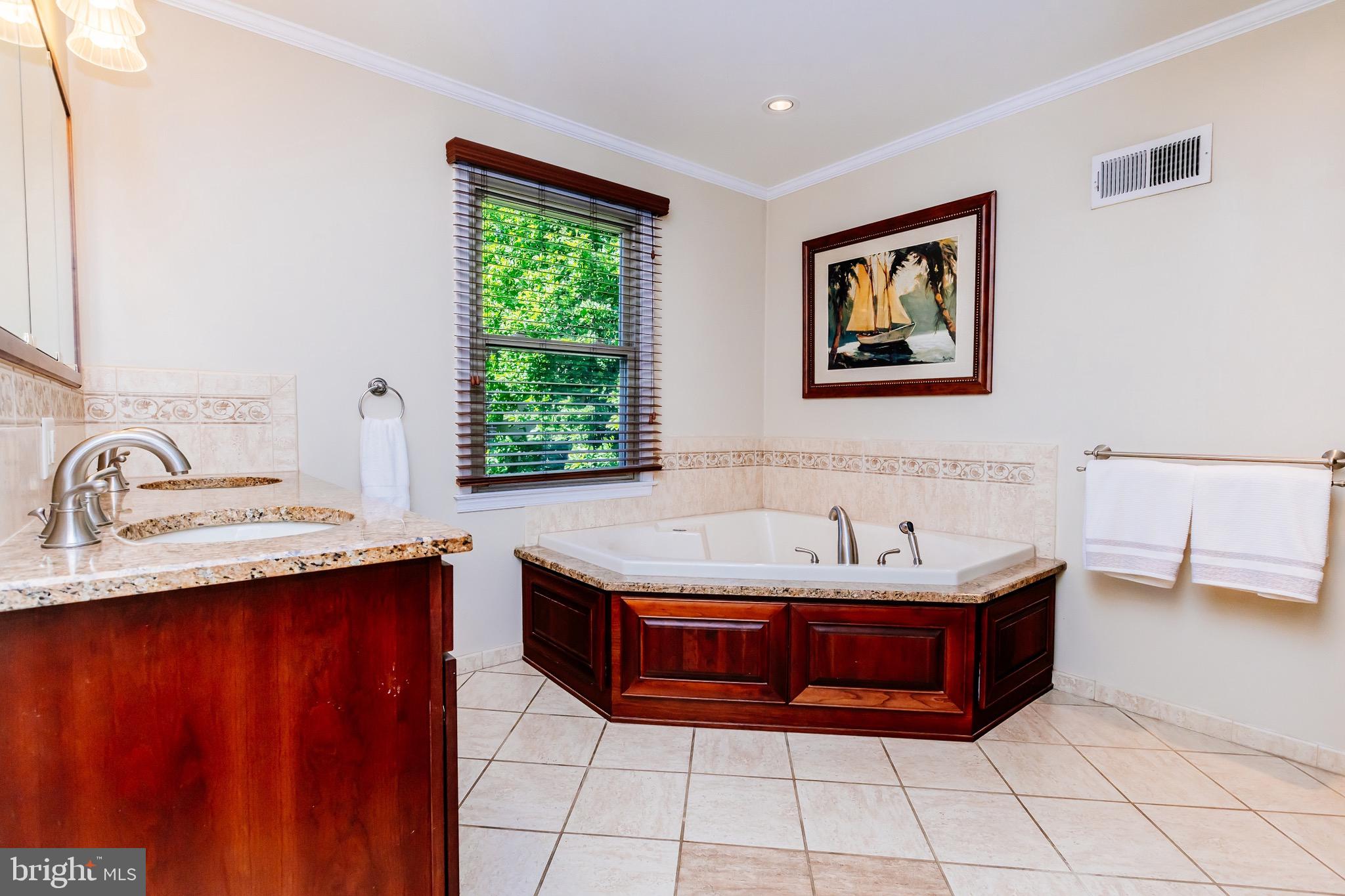 680 Fox Hollow Drive Yardley, PA 19067 - Photo 31 of 63 a bathroom with a tub sink and mirror