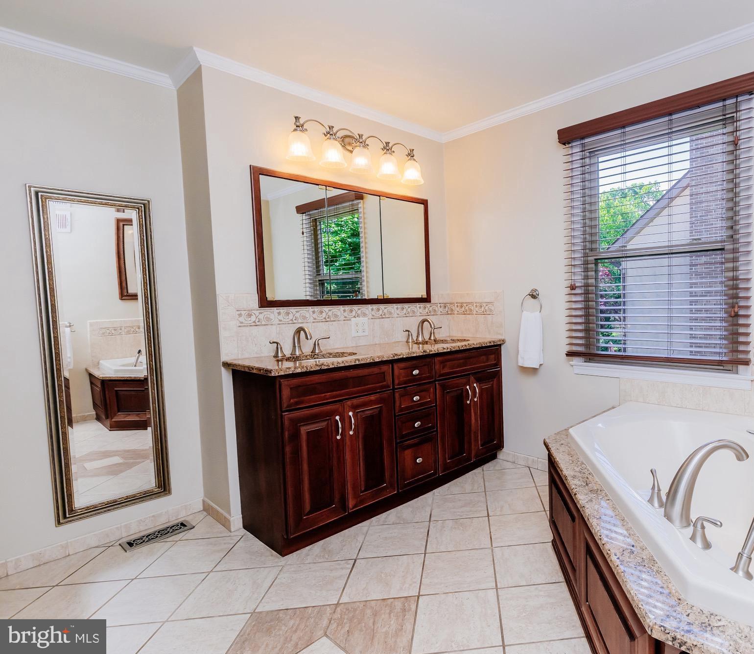 680 Fox Hollow Drive Yardley, PA 19067 - Photo 32 of 63 a bathroom with a granite countertop double vanity sink a mirror and shower