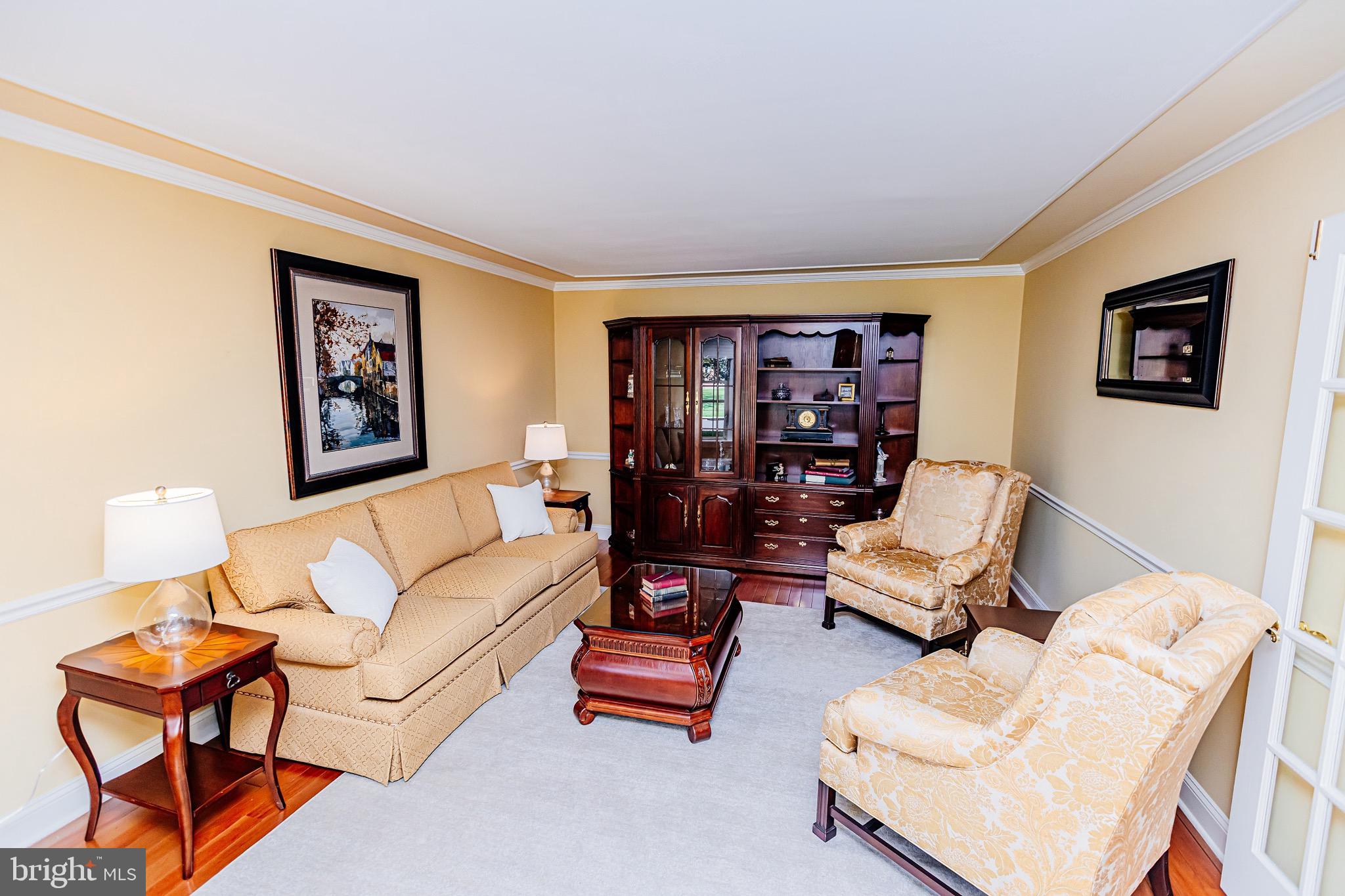 680 Fox Hollow Drive Yardley, PA 19067 - Photo 4 of 63 a living room with furniture and a bookshelf