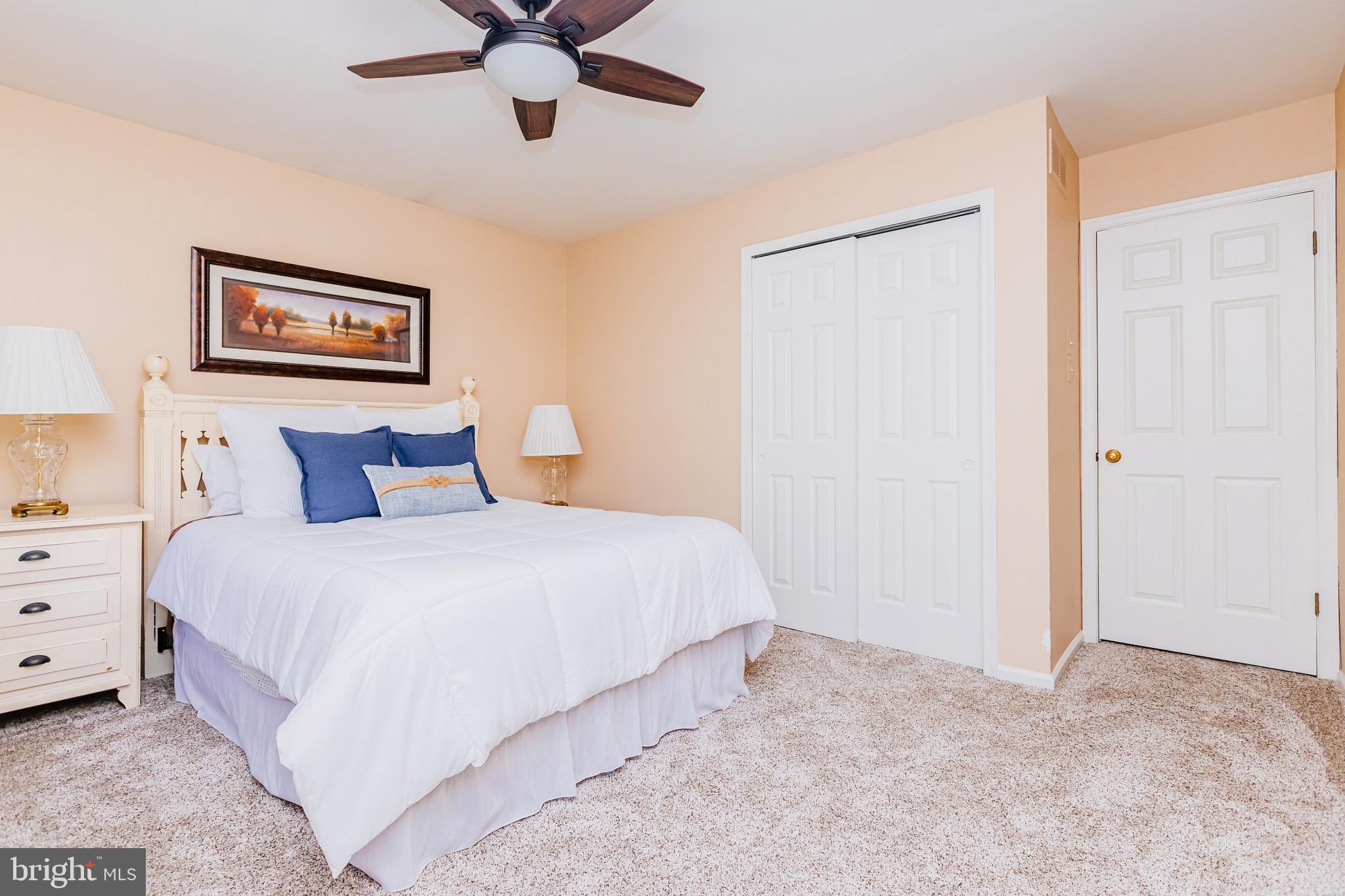 680 Fox Hollow Drive Yardley, PA 19067 - Photo 44 of 63 a bedroom with a bed and a painting on the wall