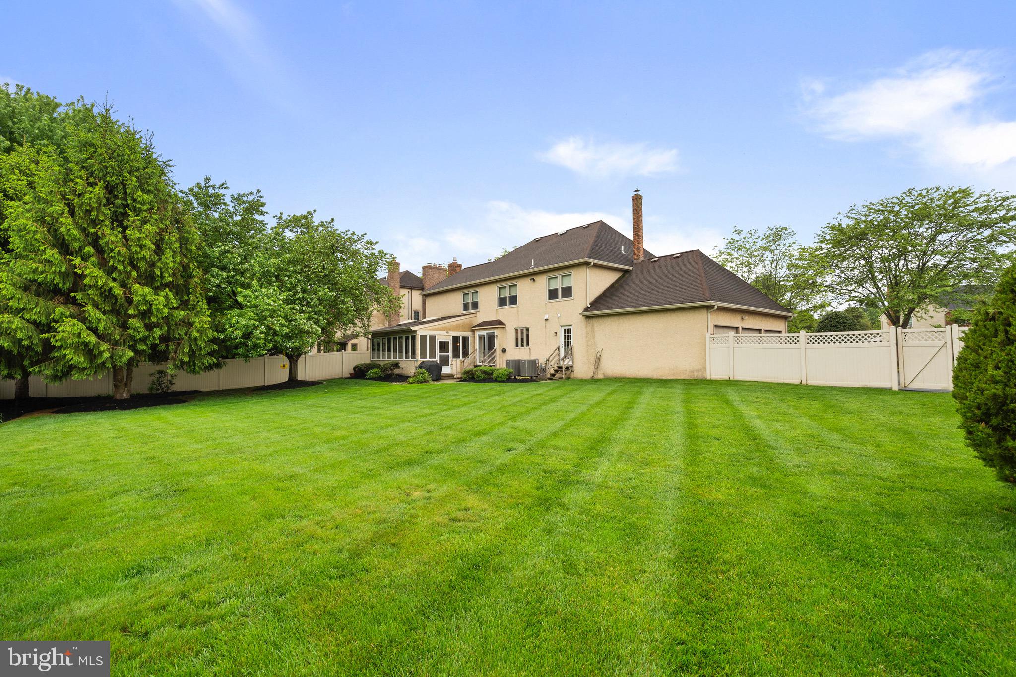 680 Fox Hollow Drive Yardley, PA 19067 - Photo 51 of 63 a view of a big house with a big yard and large trees