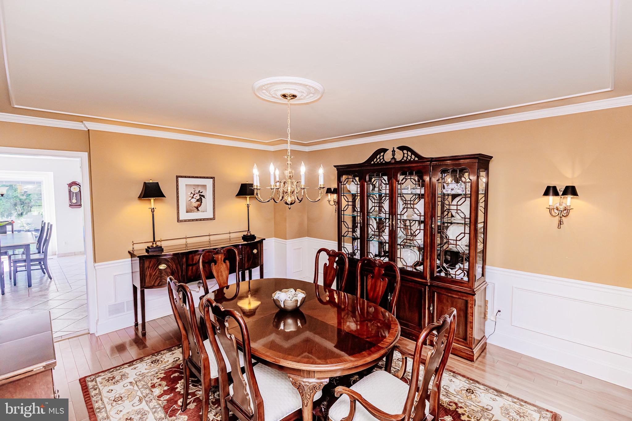 680 Fox Hollow Drive Yardley, PA 19067 - Photo 7 of 63 a view of a dining room with furniture and chandelier