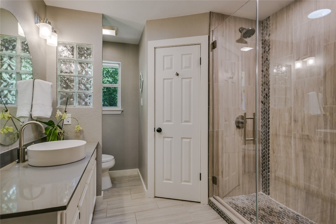 6802 Rio Bravo Lane Austin, TX 78737 - Photo 11 of 18 Bathroom with vanity and a stall shower