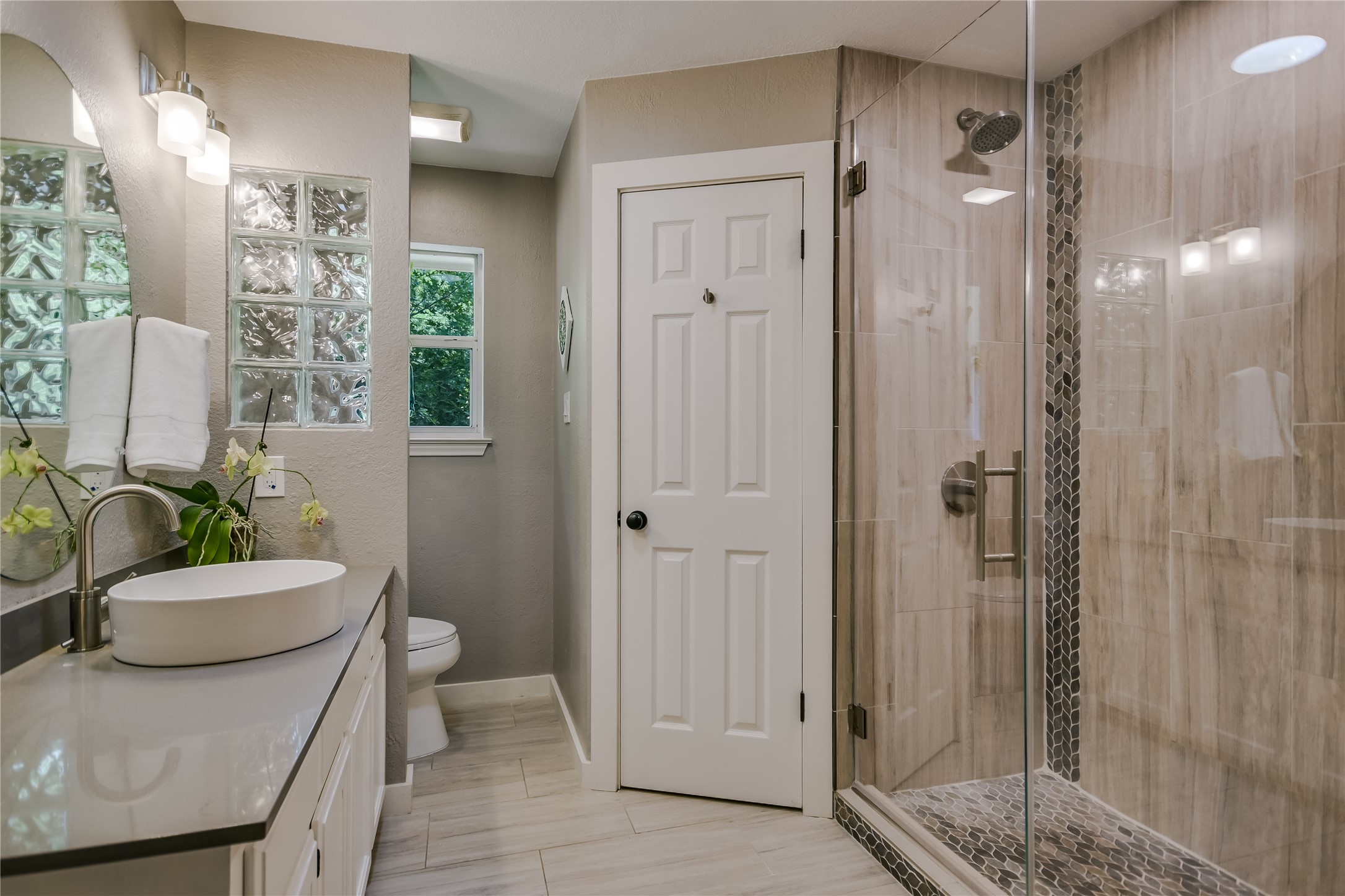 6802 Rio Bravo Lane Austin, TX 78737 - Photo 11 of 18 a bathroom with a sink a toilet and shower