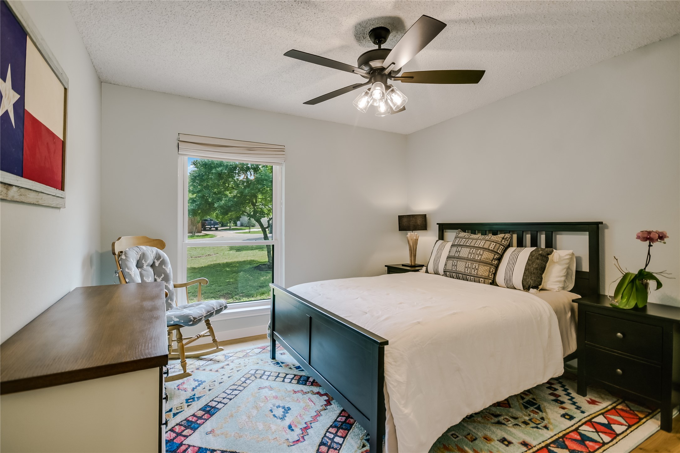 6802 Rio Bravo Lane Austin, TX 78737 - Photo 12 of 18 a bed room with a bed and a chair
