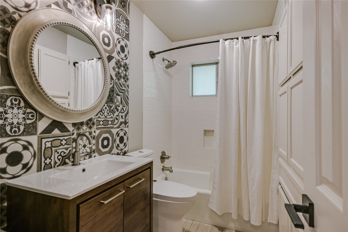 6802 Rio Bravo Lane Austin, TX 78737 - Photo 13 of 18 Bathroom with vanity and shower / bathtub combination with curtain