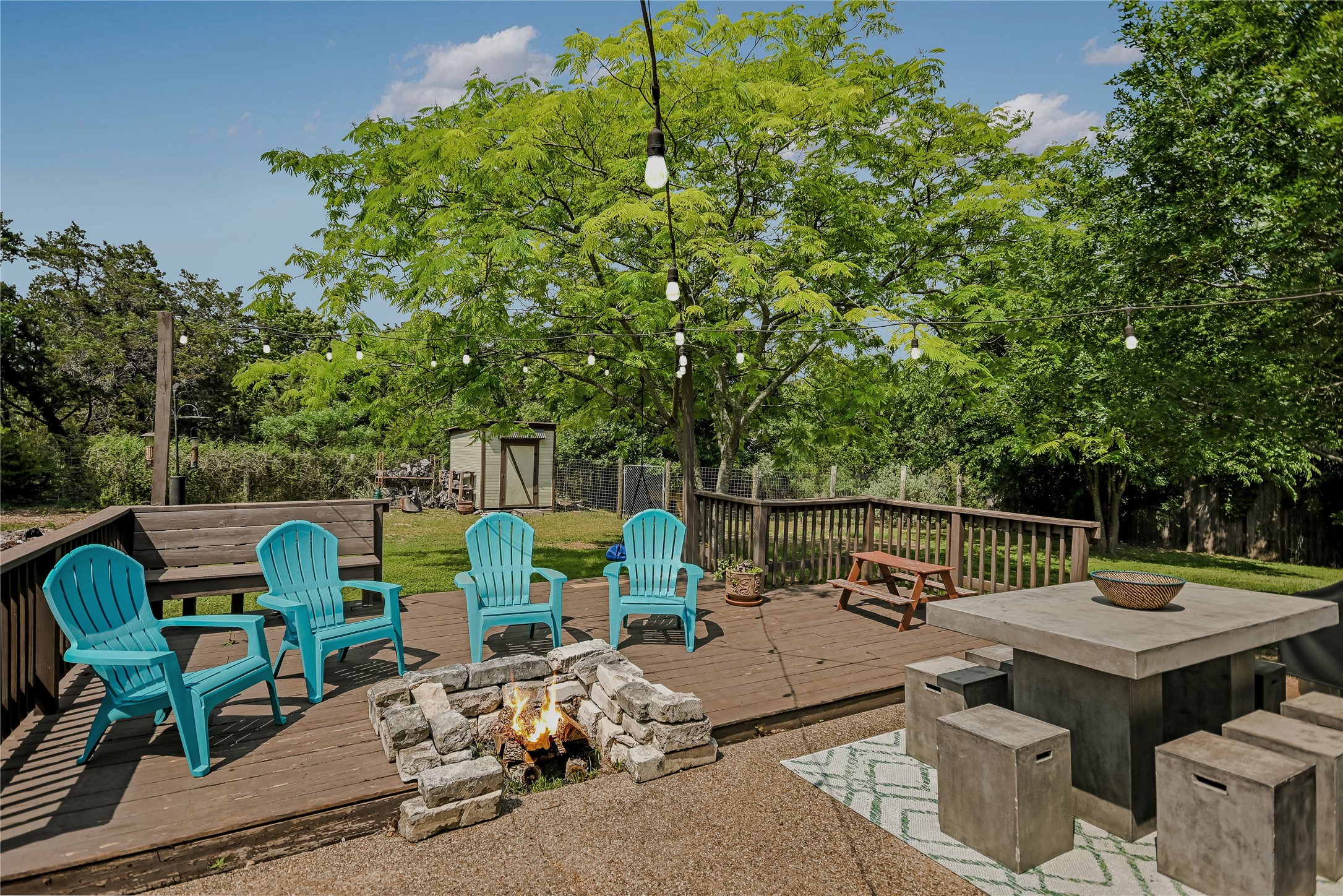 6802 Rio Bravo Lane Austin, TX 78737 - Photo 16 of 18 a view of backyard with seating area and trees around