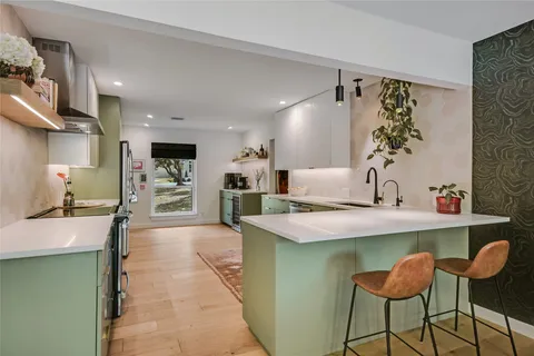 a kitchen with a table and chairs in it