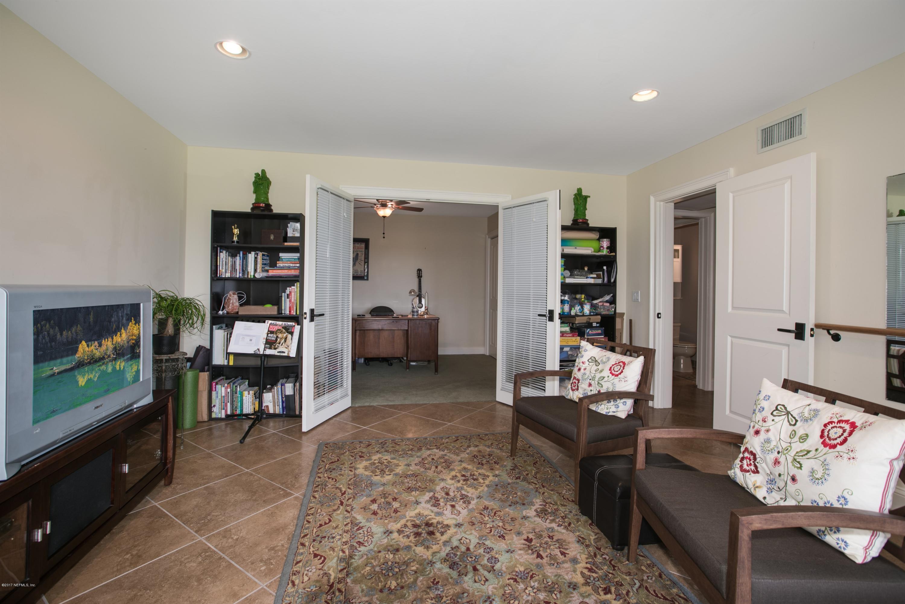 1507 San Rafael Way St. Augustine, FL 32080 - Photo 11 of 32 a living room with furniture and a flat screen tv