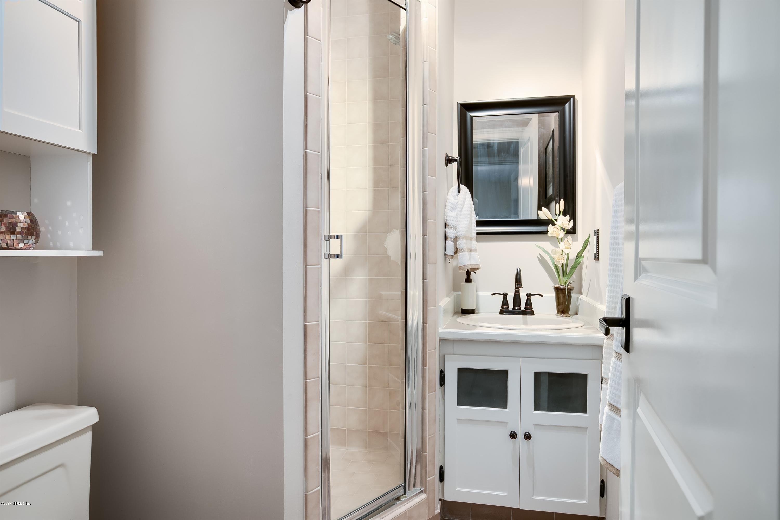 1507 San Rafael Way St. Augustine, FL 32080 - Photo 13 of 32 a bathroom with a sink and a mirror