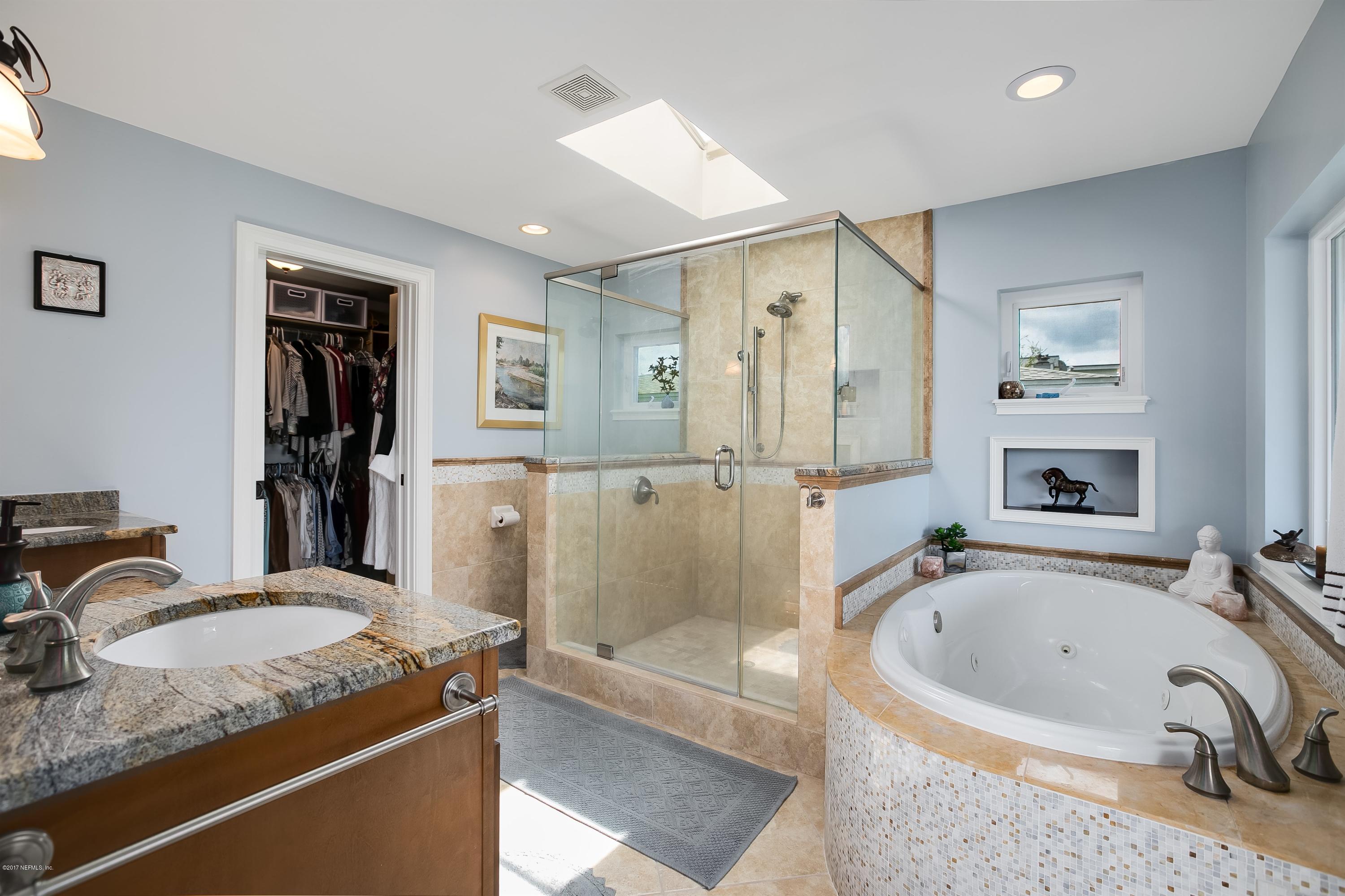 1507 San Rafael Way St. Augustine, FL 32080 - Photo 15 of 32 a bathroom with a granite countertop tub sink and mirror