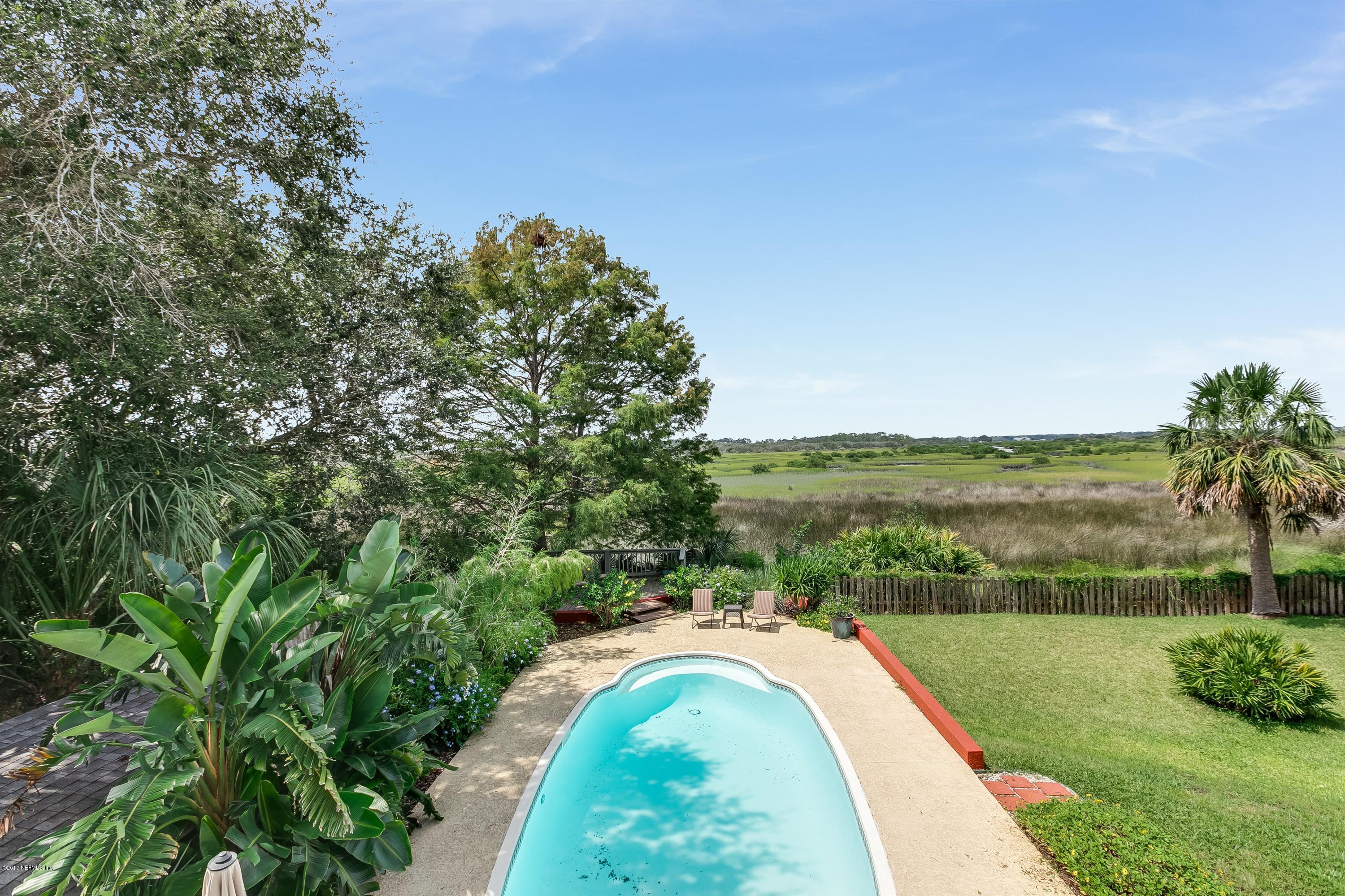 1507 San Rafael Way St. Augustine, FL 32080 - Photo 22 of 32 a view of a yard with a swimming pool and green space