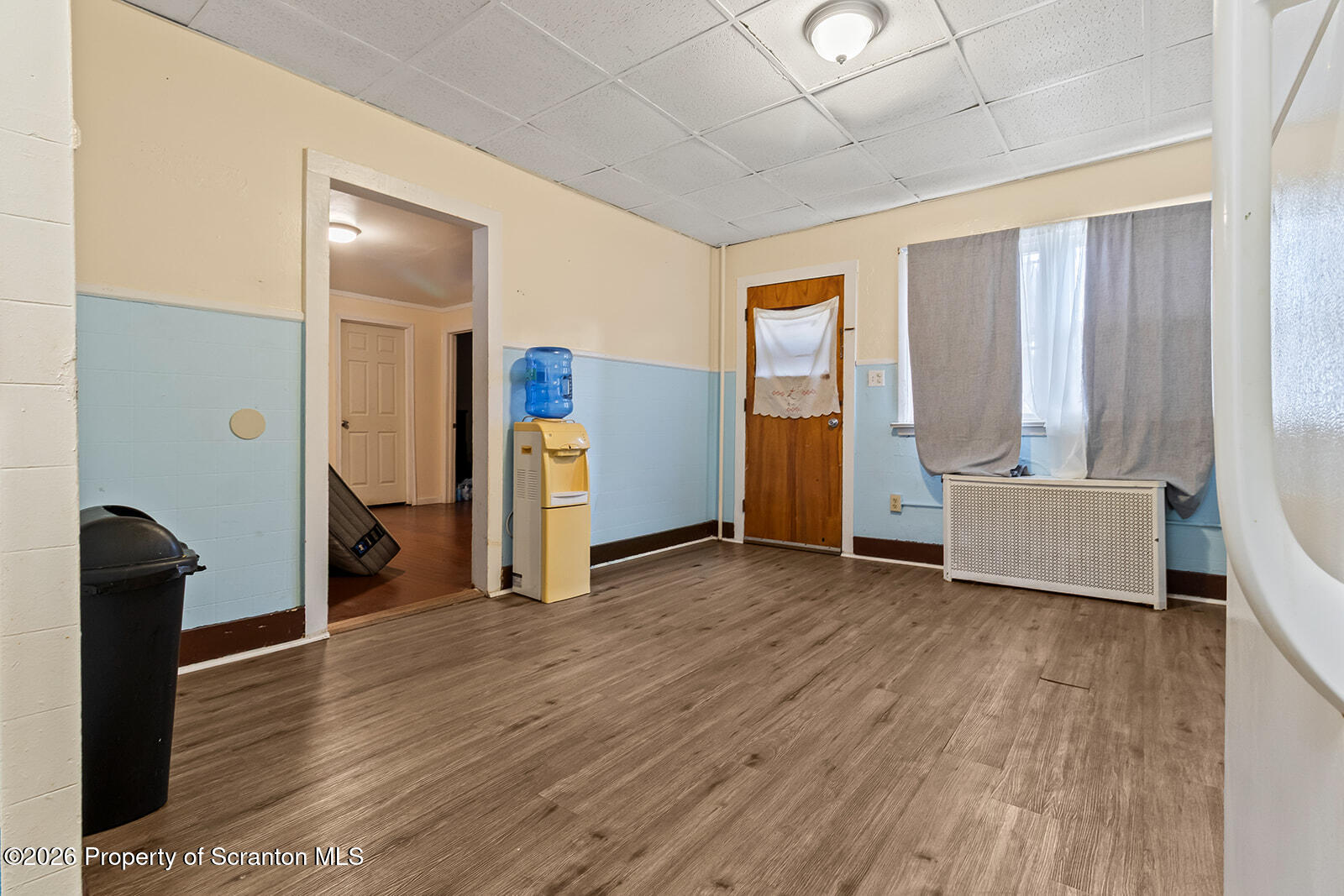 1406 North Main Avenue Scranton, PA 18508 - Photo 11 of 29 a view of an empty room with wooden floor and a window
