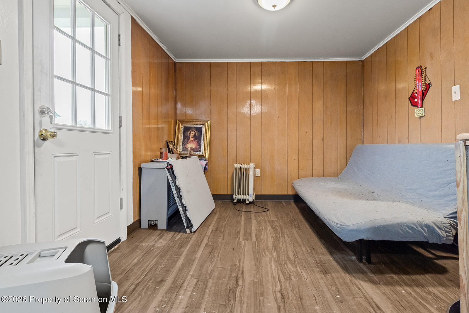 1406 North Main Avenue Scranton, PA 18508 - Photo 15 of 29 a bedroom with a bed and wooden floor