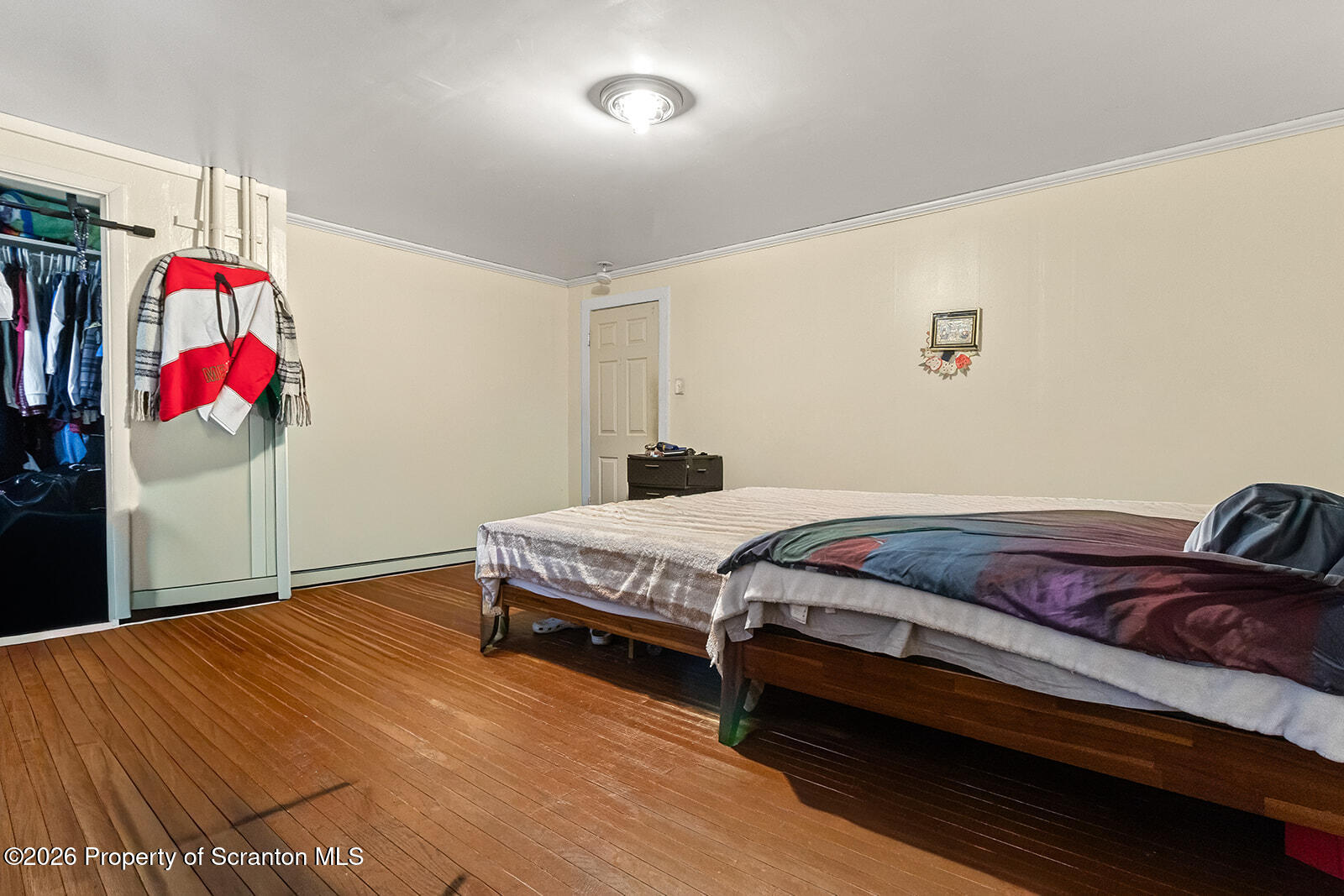1406 North Main Avenue Scranton, PA 18508 - Photo 17 of 29 a bedroom with a bed and cabinets