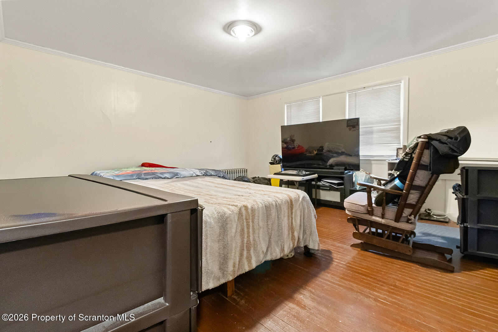 1406 North Main Avenue Scranton, PA 18508 - Photo 18 of 29 a bedroom with a bed and a flat screen tv
