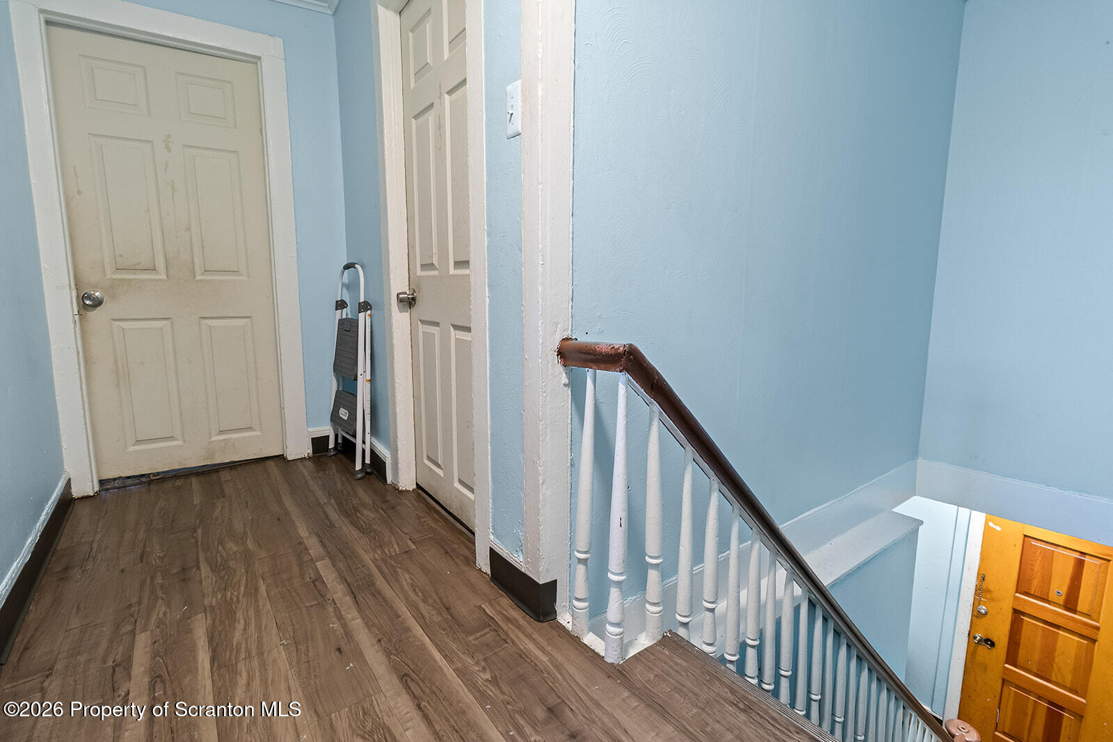 1406 North Main Avenue Scranton, PA 18508 - Photo 19 of 29 a view of a hallway with wooden floor and staircase