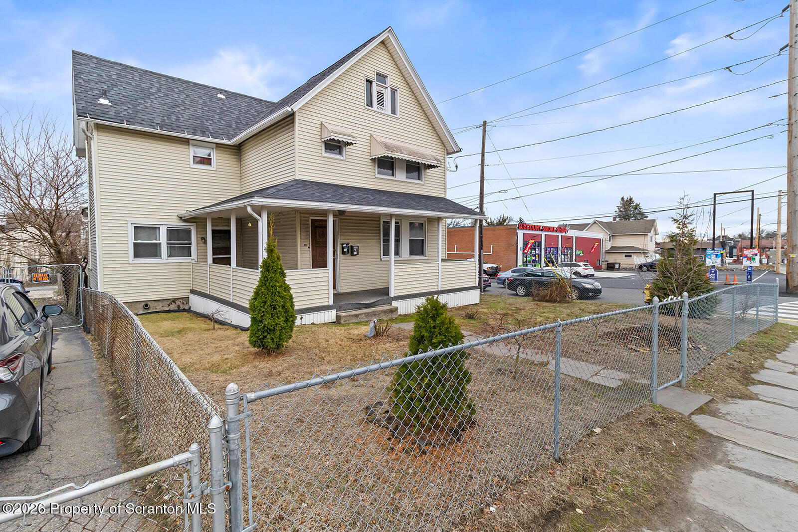 1406 North Main Avenue Scranton, PA 18508 - Photo 3 of 29 a front view of a house with garden