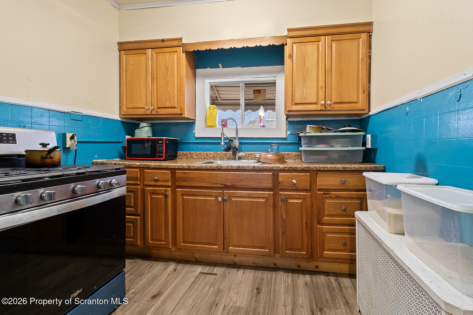 1406 North Main Avenue Scranton, PA 18508 - Photo 8 of 29 a kitchen with stainless steel appliances granite countertop a sink stove and cabinets