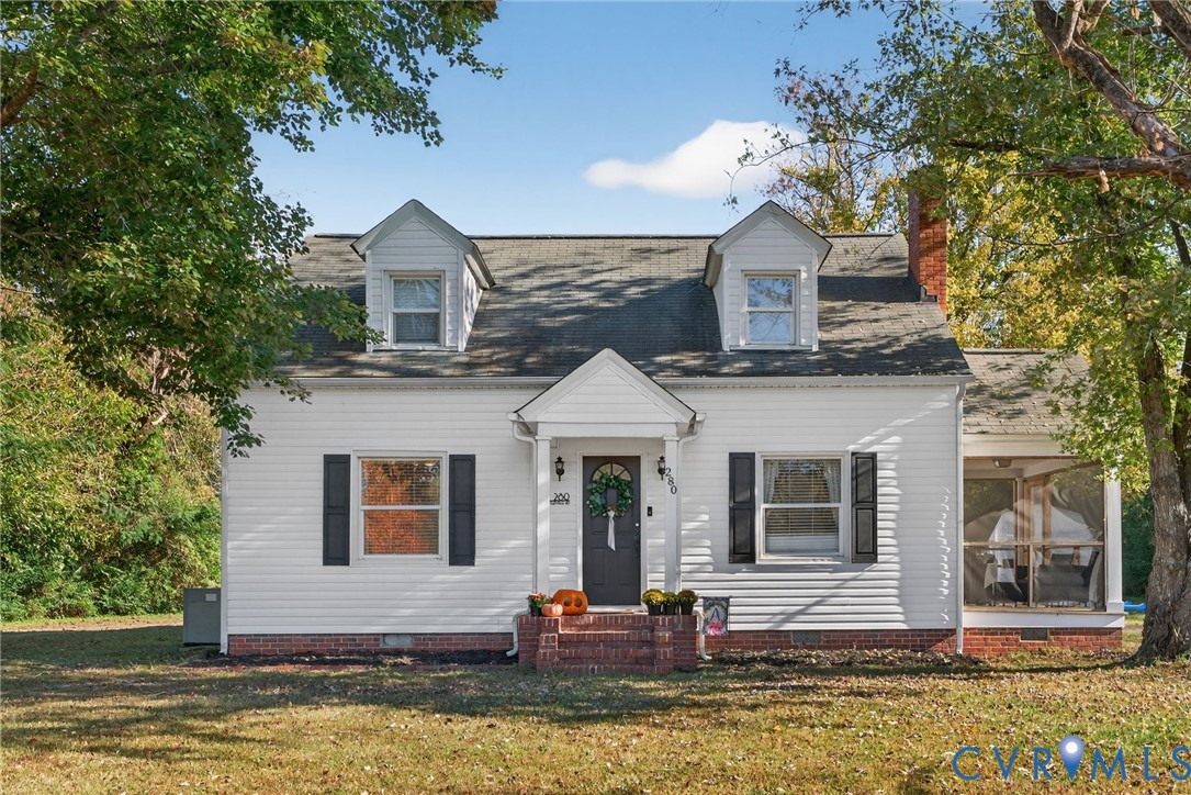 a front view of a house with swimming pool and porch