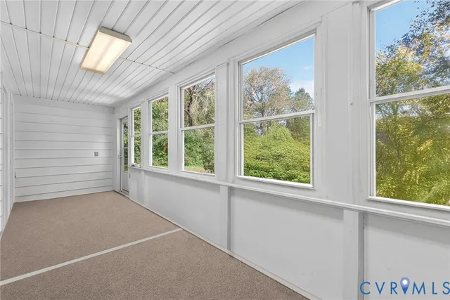 a room with a table and chairs