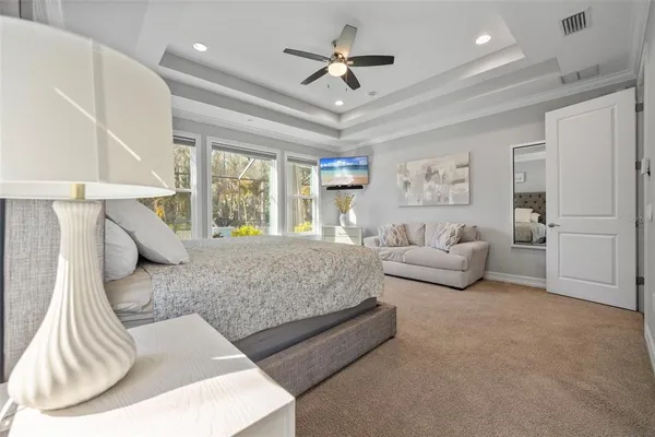 a bathroom with a sink a large mirror and a shower