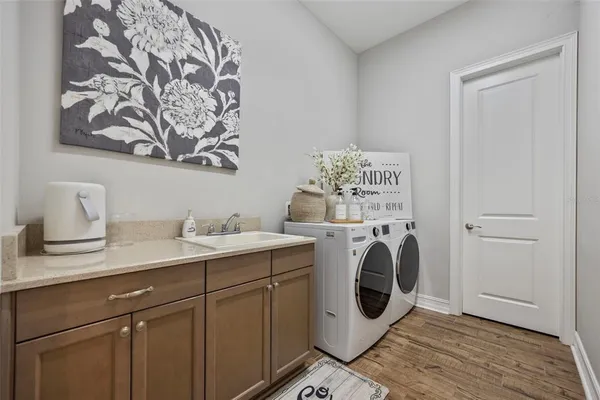 a view of a chair and tables in the patio