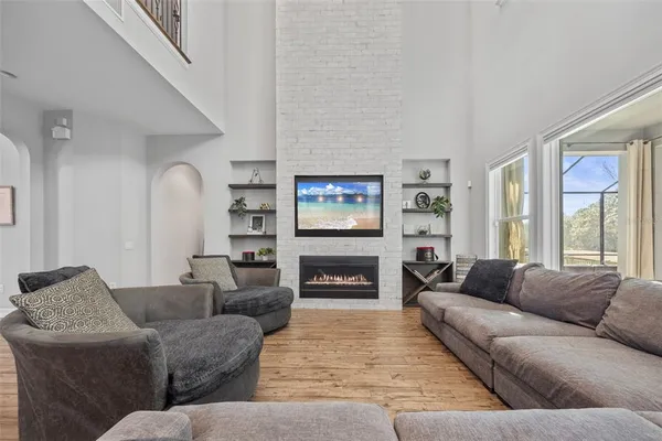 a bathroom with a granite countertop sink mirror and a bathtub