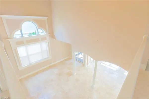 a open kitchen with stainless steel appliances granite countertop a refrigerator and a stove
