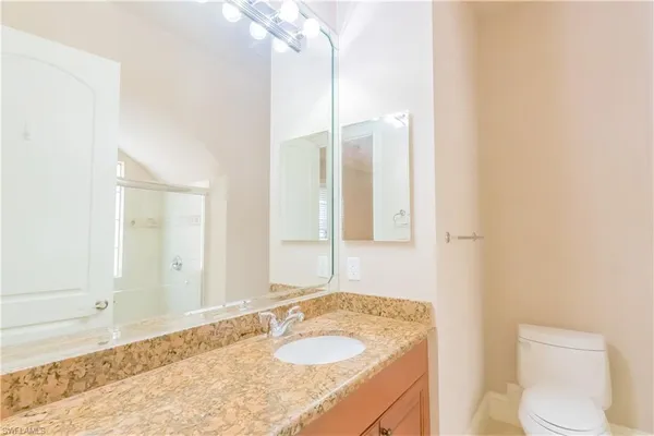 a bathroom with a shower and a glass door