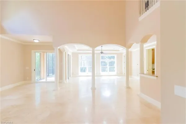 a view of an empty room with glass door