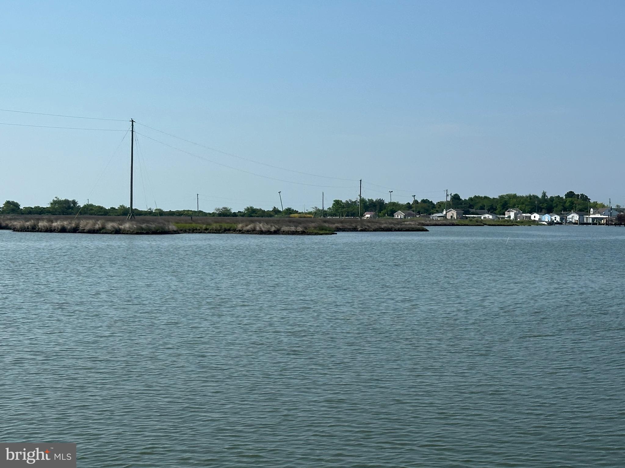 21125 Bay Berry Road Tylerton, MD 21866 - Photo 18 of 20 a view of a lake with houses in background