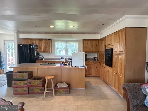 a kitchen with counter top space cabinets and stainless steel appliances