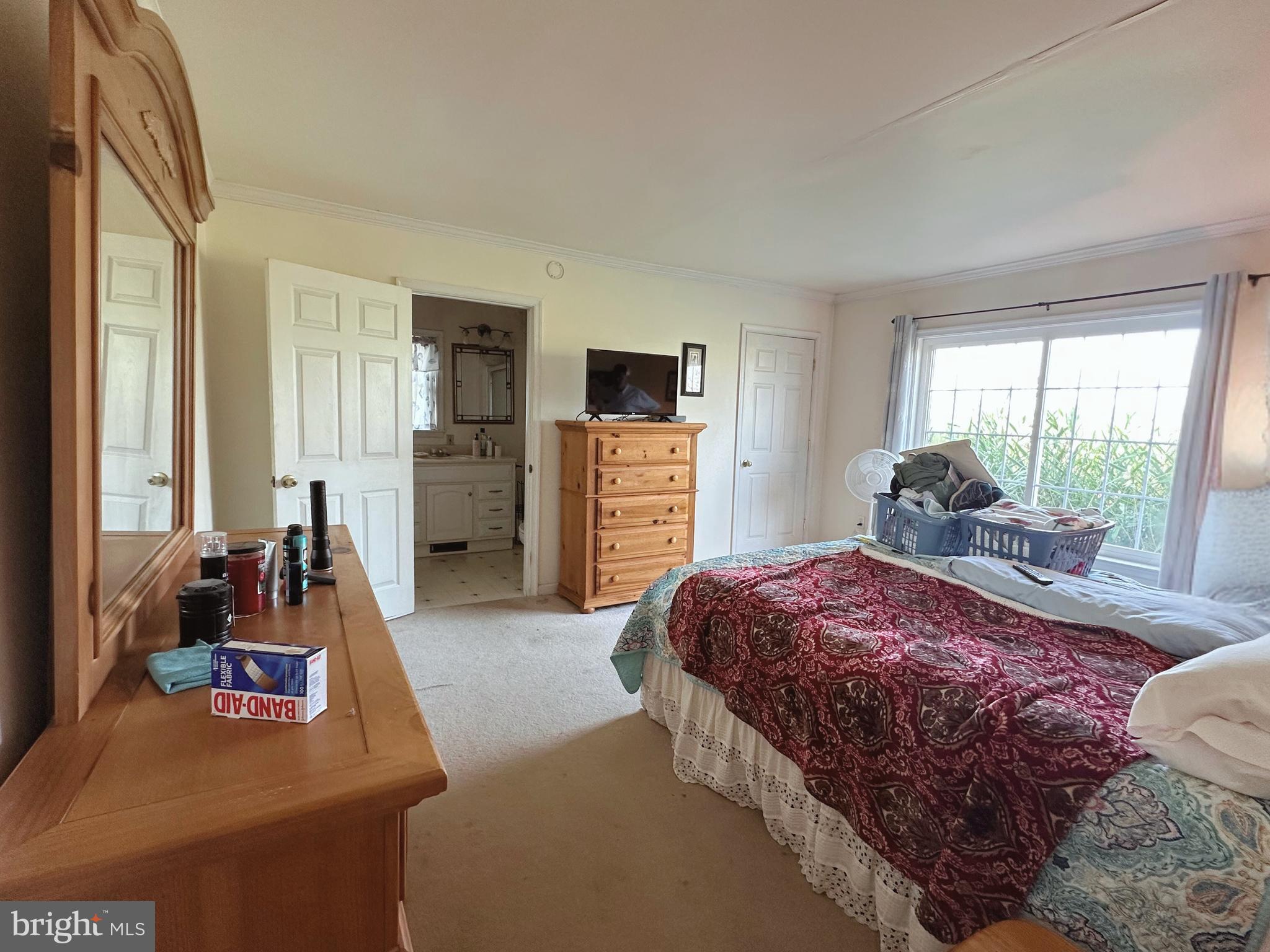 21125 Bay Berry Road Tylerton, MD 21866 - Photo 6 of 20 a bedroom with a bed and wooden floor