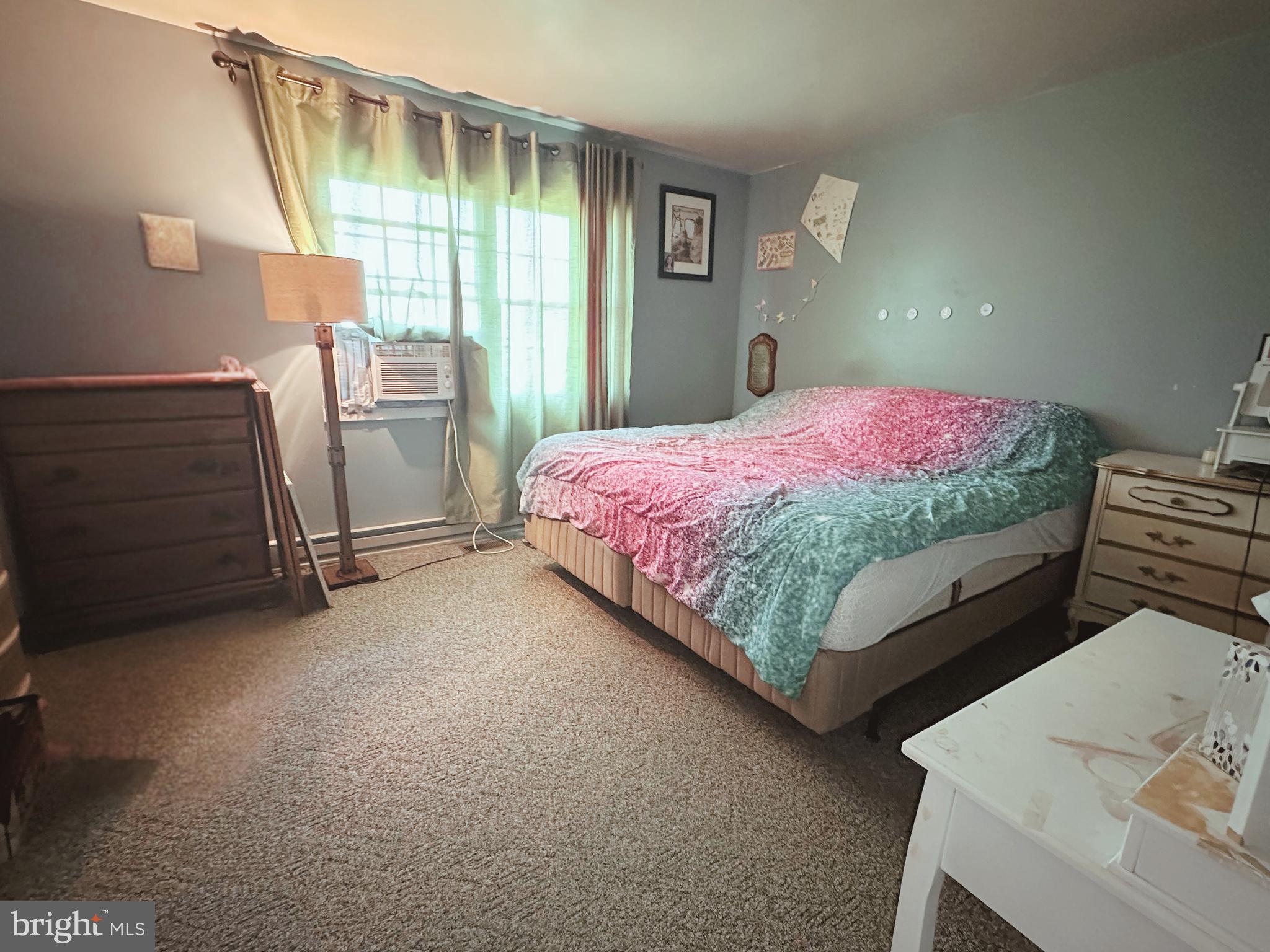 21125 Bay Berry Road Tylerton, MD 21866 - Photo 10 of 20 a bed sitting in a room next to a window