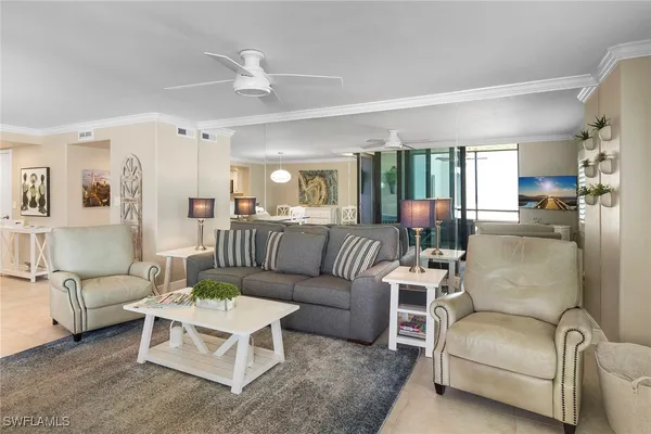 a kitchen with stainless steel appliances kitchen island granite countertop a table and chairs in it