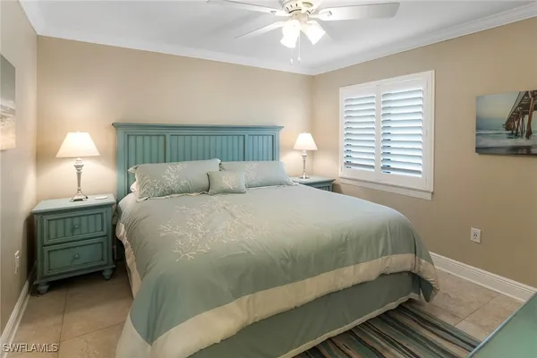 a bedroom with a bed and a desk