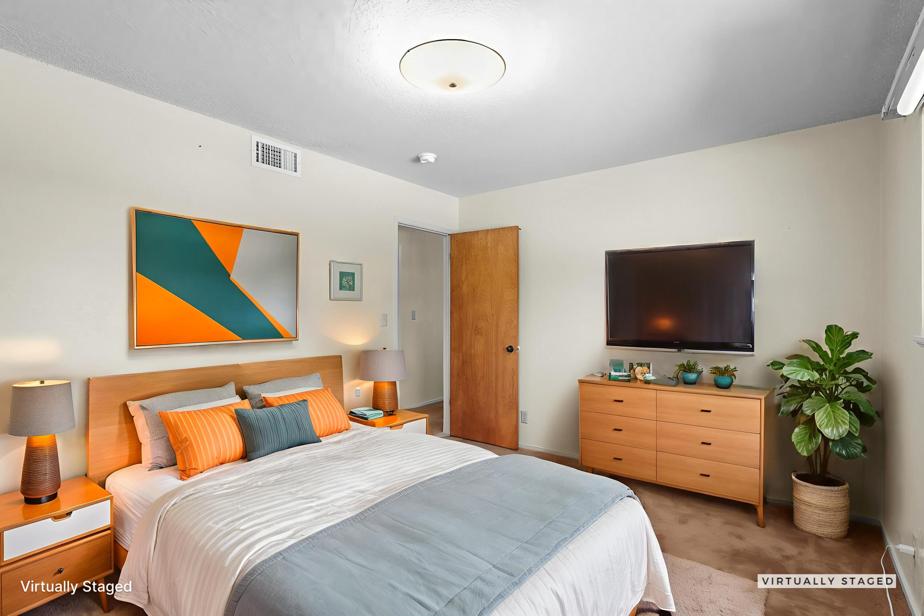 910 Hallmark Drive Redding, CA 96001 - Photo 12 of 40 a bedroom with a bed and a flat screen tv