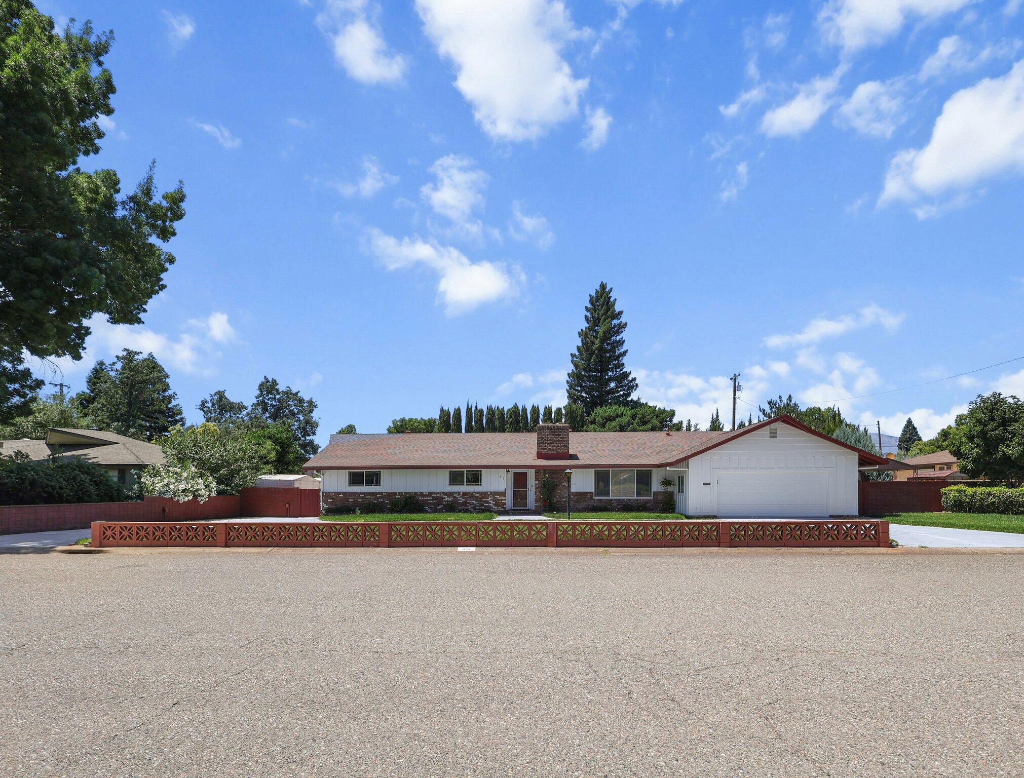 910 Hallmark Drive Redding, CA 96001 - Photo 34 of 40 a front view of a house with a yard and street
