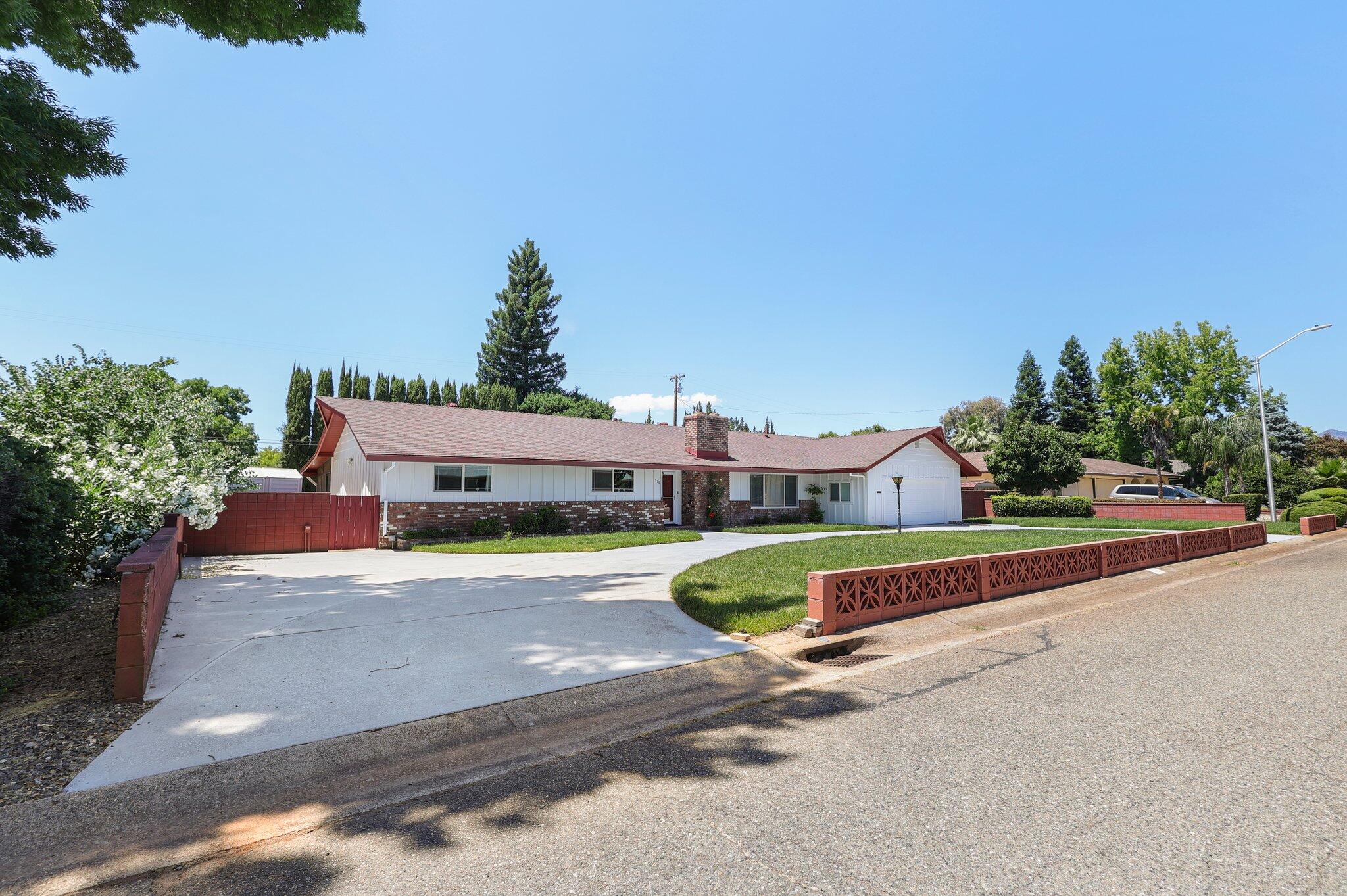 910 Hallmark Drive Redding, CA 96001 - Photo 36 of 40 a view of a house with a street