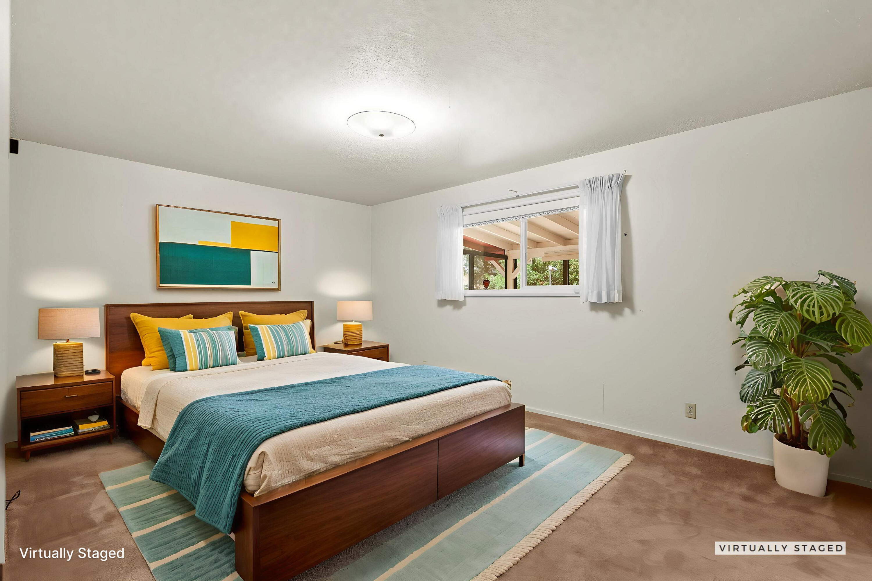 910 Hallmark Drive Redding, CA 96001 - Photo 10 of 40 a bedroom with a bed and a painting on the wall