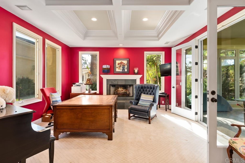 1620 Bella Vista Drive Encinitas, CA 92024 - Photo 12 of 35 a living room with furniture gym equipment and a fireplace