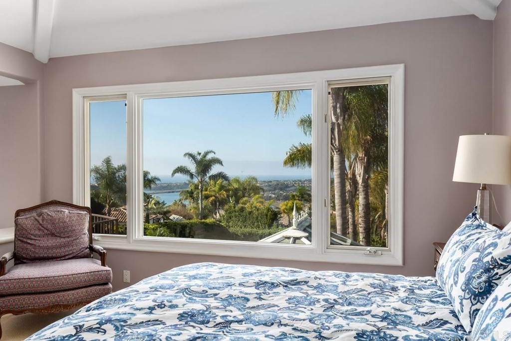 1620 Bella Vista Drive Encinitas, CA 92024 - Photo 14 of 35 a living room with a couch and a potted plant