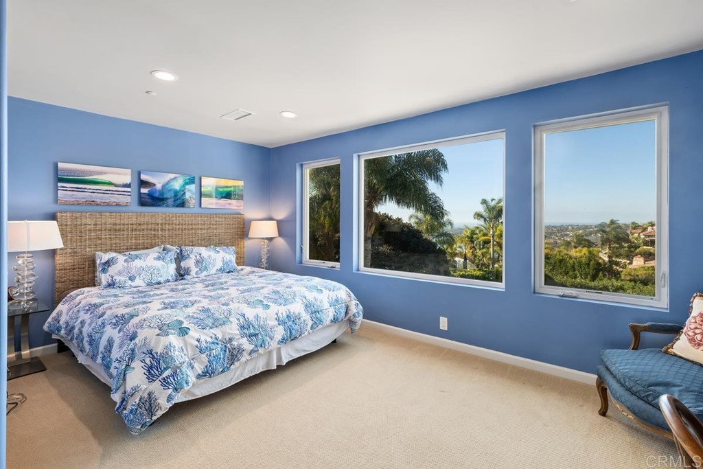1620 Bella Vista Drive Encinitas, CA 92024 - Photo 21 of 35 a bedroom with a bed and a large window