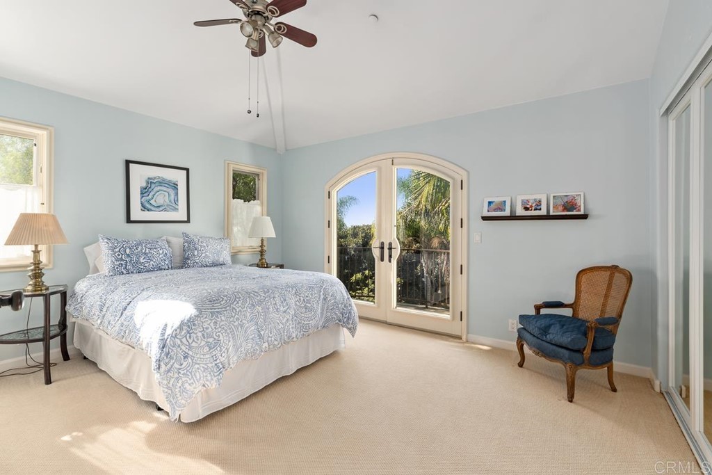 1620 Bella Vista Drive Encinitas, CA 92024 - Photo 22 of 35 a spacious bedroom with a bed and a chair