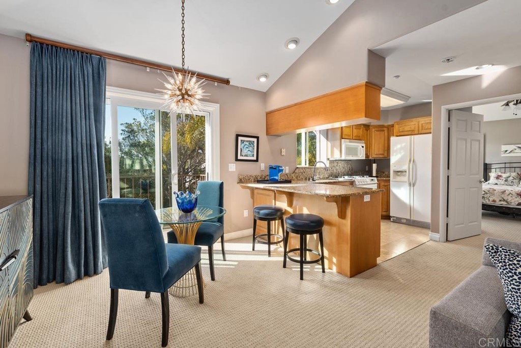 1620 Bella Vista Drive Encinitas, CA 92024 - Photo 26 of 35 a living room with stainless steel appliances kitchen island granite countertop furniture and a large window