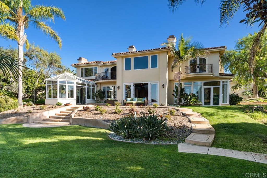 1620 Bella Vista Drive Encinitas, CA 92024 - Photo 31 of 35 a front view of a house with swimming pool garden and patio